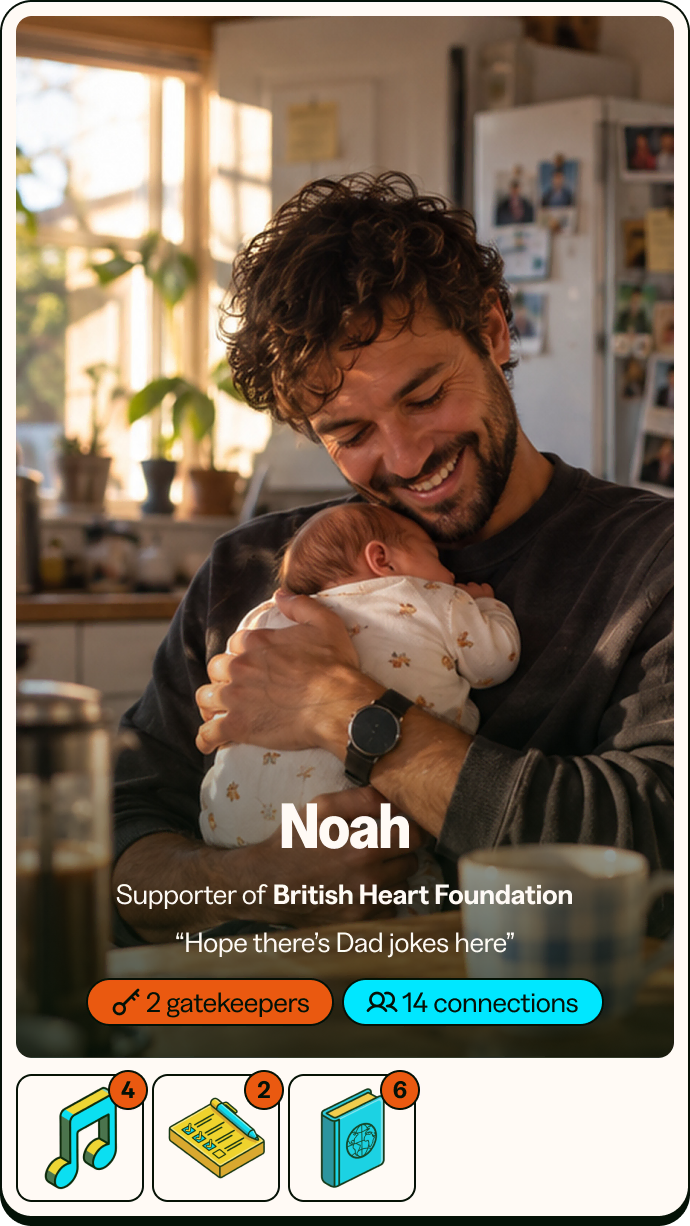 Noah’s 25 Card: a man smiling down at a baby in his arms, in a bright kitchen